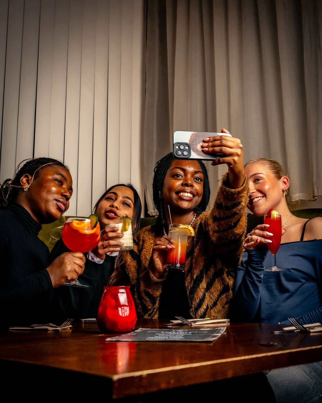 Friends selfie with cocktails